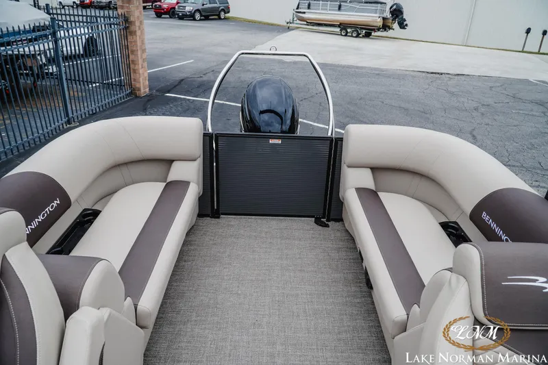 Slide: The Image of 2026 Bennington 23SSR pontoon boat interior with plush seating at Lake Norman Marina. - 18