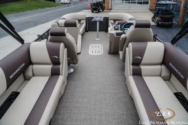 Slide: The Image of 2026 Bennington 23SSR pontoon boat interior with luxurious seating at Lake Norman Marina. - 5