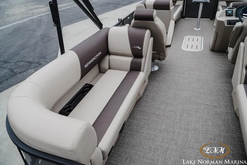 Slide: The Image of 2026 Bennington 23SSR pontoon boat interior with beige and brown seating, Lake Norman Marina. - 6