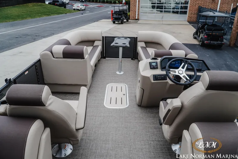Slide: The Image of 2026 Bennington 23SSR pontoon boat interior with plush seating and modern helm. - 8