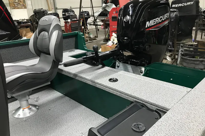 Slide: The Image of 2026 Lund 1700 Explorer Tiller boat interior with Mercury outboard motor. - 14