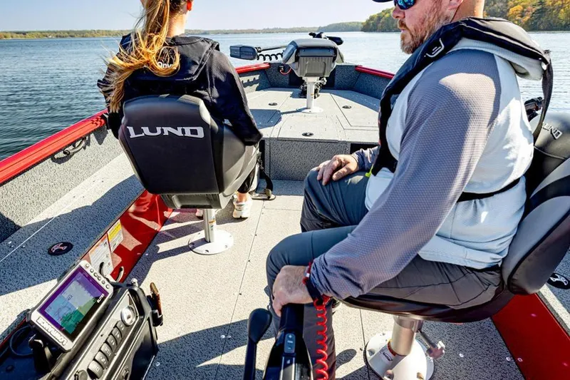 Slide: The Image of 2026 Lund 1700 Explorer Tiller boat interior with seating and storage compartments. - 3