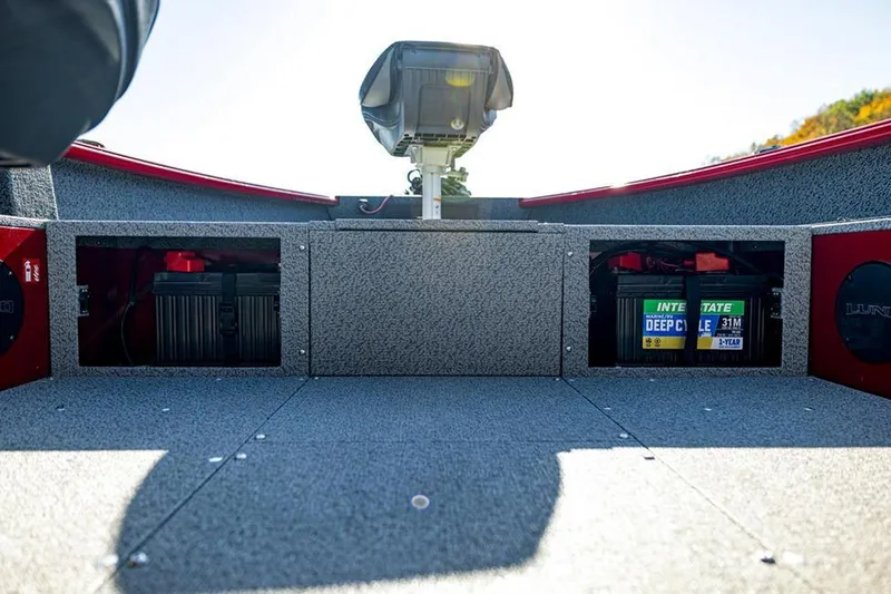 Slide: The Image of 2026 Lund 1700 Explorer Tiller boat in a workshop, featuring modern seating and design. - 4