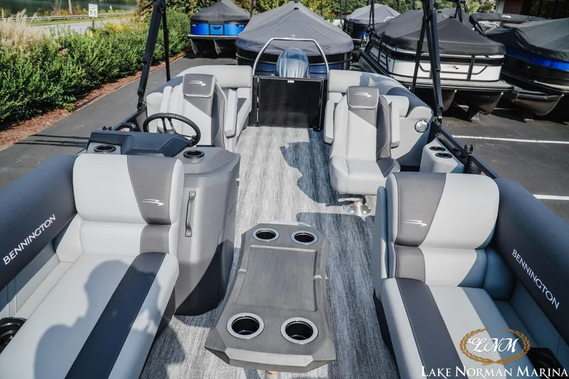Slide: The Image of 2026 Bennington 22SSR pontoon boat with luxurious seating at Lake Norman Marina. - 14