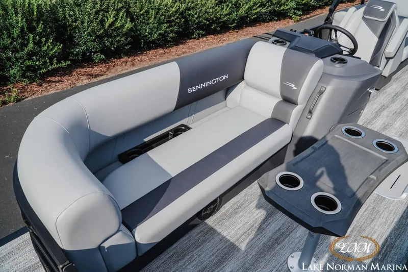 Slide: The Image of 2026 Bennington 22SSR pontoon boat interior with gray seating and cup holders. - 15