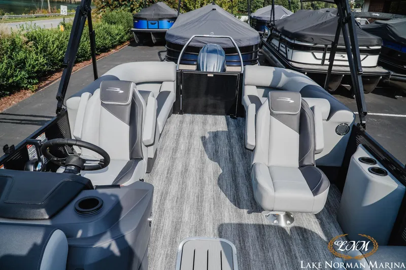 Slide: The Image of 2026 Bennington 22SSR pontoon boat interior with gray seating at Lake Norman Marina. - 17