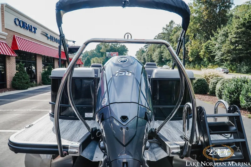 Slide: The Image of 2026 Bennington 22SSR pontoon boat with powerful outboard motor at Lake Norman Marina. - 4