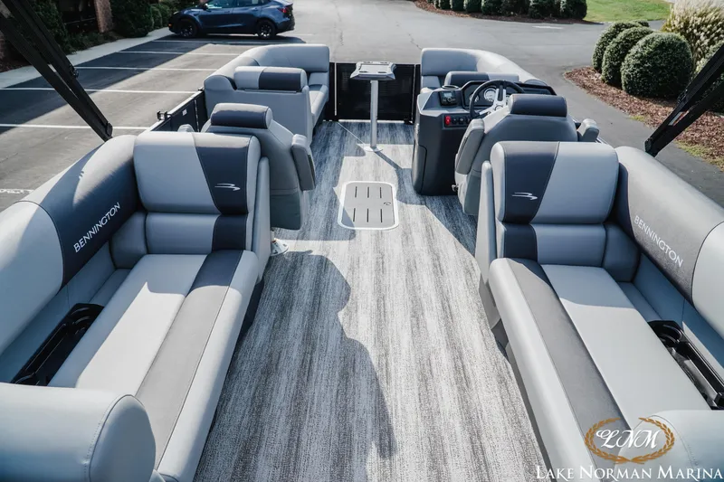 Slide: The Image of 2026 Bennington 22SSR pontoon boat interior with plush seating at Lake Norman Marina. - 5