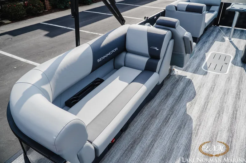 Slide: The Image of 2026 Bennington 22SSR pontoon boat with luxurious seating at Lake Norman Marina. - 6