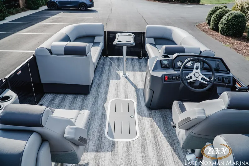 Slide: The Image of 2026 Bennington 22SSR pontoon boat interior with plush seating and modern dashboard. - 8