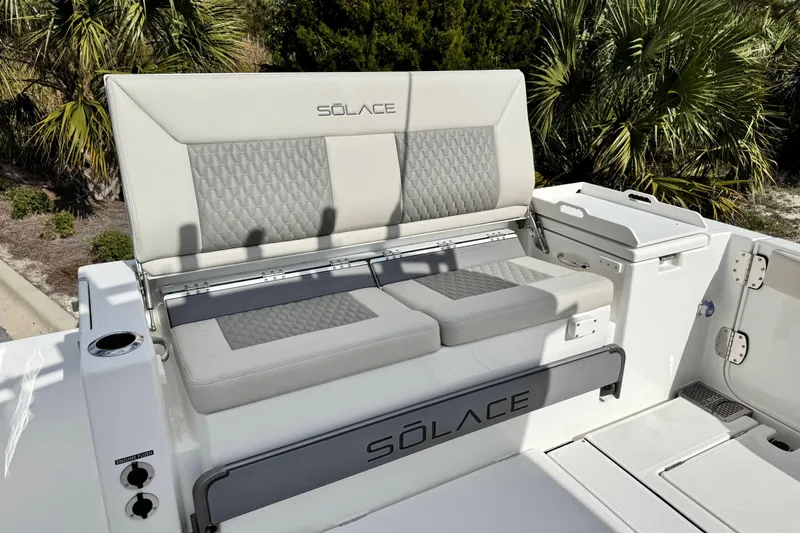 Slide: The Image of 2026 Solace 30 CS boat seating area with modern design and integrated storage. - 10