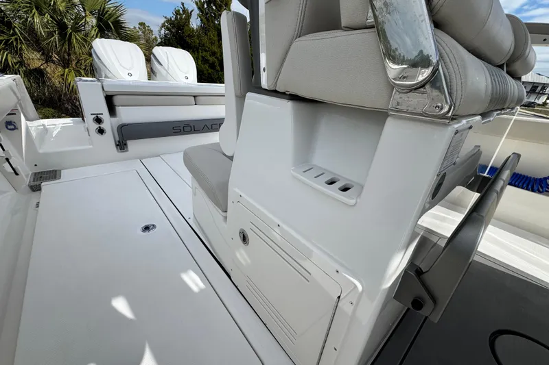 Slide: The Image of 2026 Solace 30 CS boat interior with seating and storage compartments. - 23