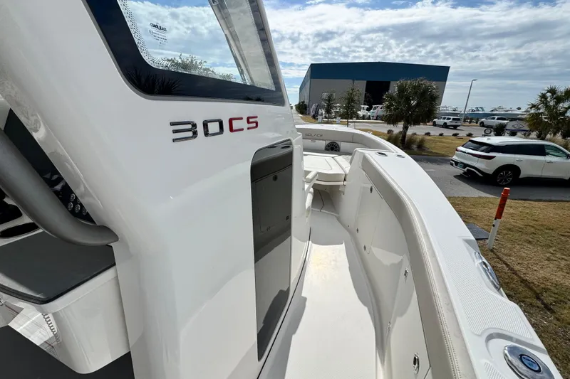 Slide: The Image of 2026 Solace 30 CS boat exterior with sleek design and modern features. - 24