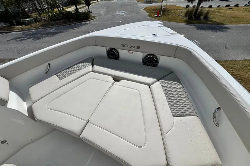 Slide: The Image of Luxurious seating area on 2026 Solace 30 CS boat, featuring cushioned upholstery and integrated speakers. - 26