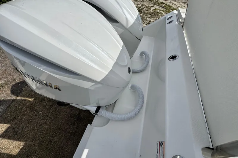 Slide: The Image of 2026 Solace 30 CS boat with dual outboard engines, featuring sleek design and modern fittings. - 8