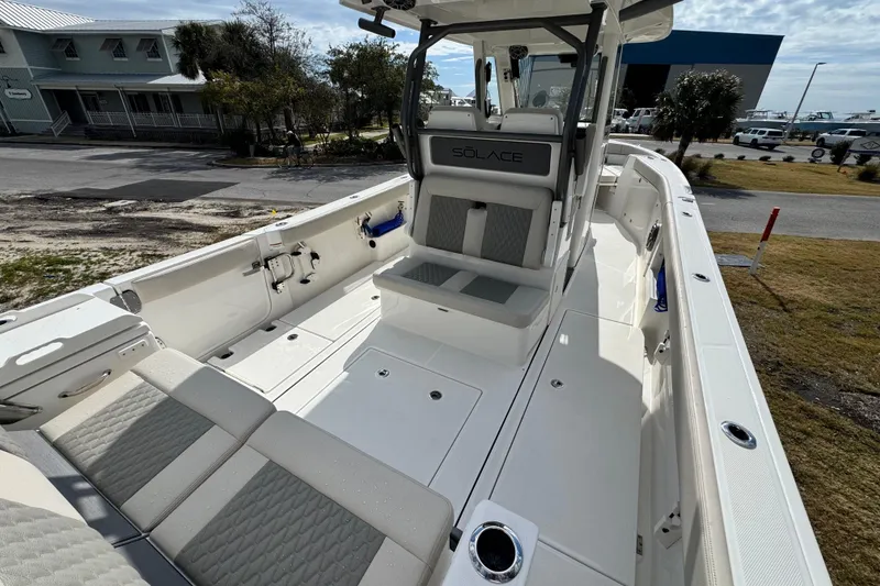 Slide: The Image of 2026 Solace 30 CS boat interior with sleek seating and modern design. - 9