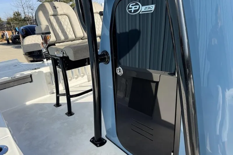 Slide: The Image of 2024 Sea Pro 230 Bay boat interior with seating and console details. - 10