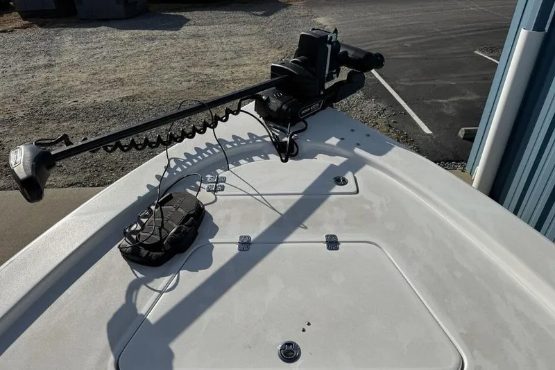 Slide: The Image of 2024 Sea Pro 230 Bay boat deck with trolling motor and storage compartments. - 20