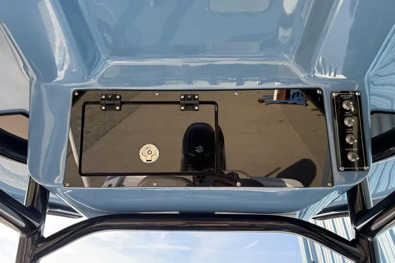 Slide: The Image of 2024 Sea Pro 230 Bay boat console with control panel and storage compartment. - 31