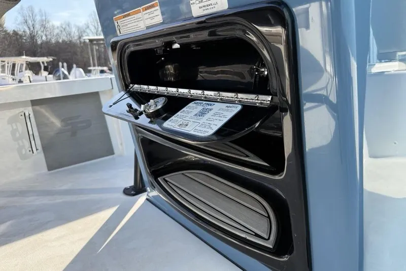 Slide: The Image of 2024 Sea Pro 230 Bay boat console with open storage compartment. - 33