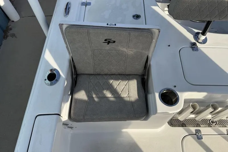Slide: The Image of 2024 Sea Pro 230 Bay boat seat with cup holder and rod storage. - 37