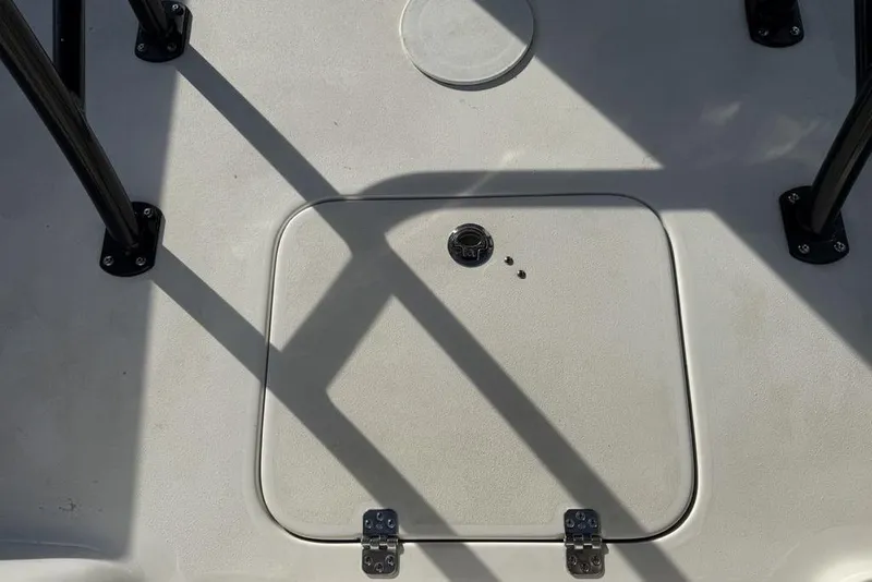 Slide: The Image of 2024 Sea Pro 230 Bay boat deck with hatch and shadowed railings. - 42