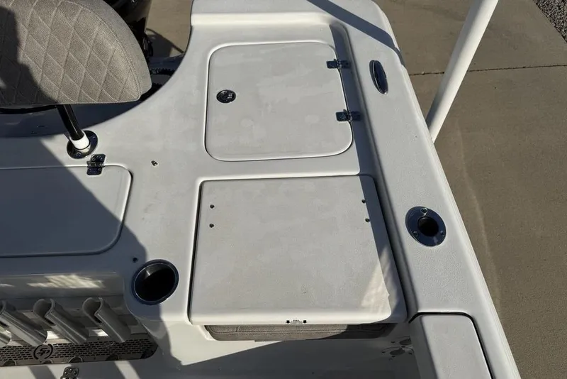 Slide: The Image of 2024 Sea Pro 230 Bay boat deck with storage compartments and cup holders. - 44