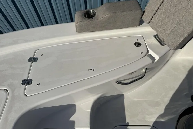 Slide: The Image of 2024 Sea Pro 230 Bay boat interior with storage compartment and seating. - 5