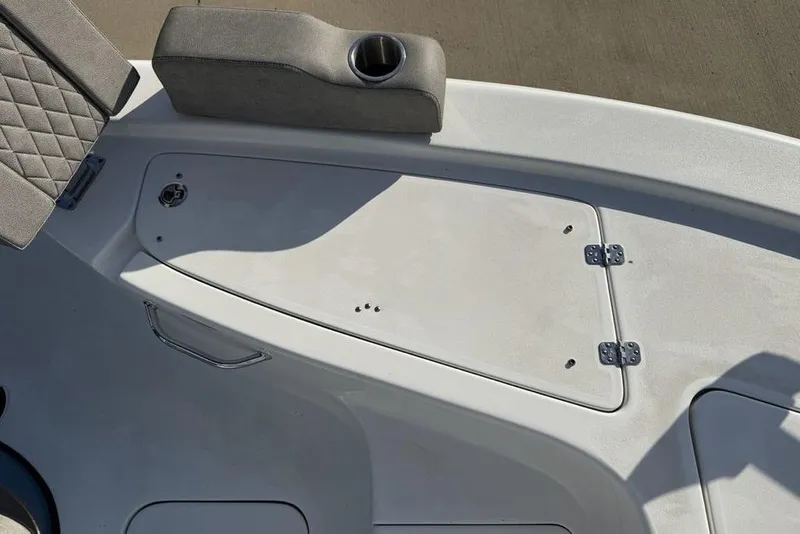 Slide: The Image of 2024 Sea Pro 230 Bay boat deck with storage compartment and cushioned seating. - 51