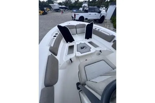 Slide: The Image of 2021 Sea Fox 228 Commander boat interior with cushioned seating and storage compartments. - 6