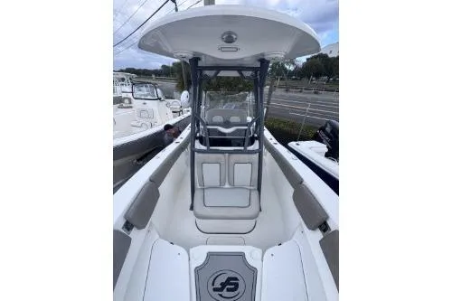 Slide: The Image of 2021 Sea Fox 228 Commander boat with T-top and seating, docked at marina. - 7