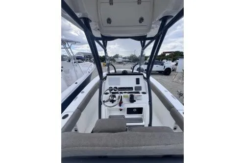 Slide: The Image of 2021 Sea Fox 228 Commander boat interior with steering console and seating. - 9