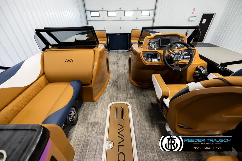 Slide: The Image of Luxurious 2026 Avalon LSZ ELW boat interior with tan seating and modern dashboard. - 17