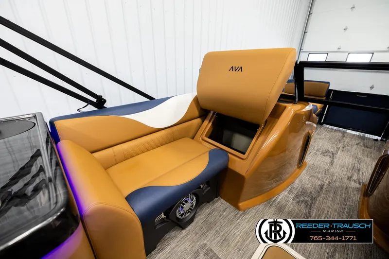 Slide: The Image of Luxurious interior of 2026 Avalon LSZ ELW boat with tan and blue seating. - 26