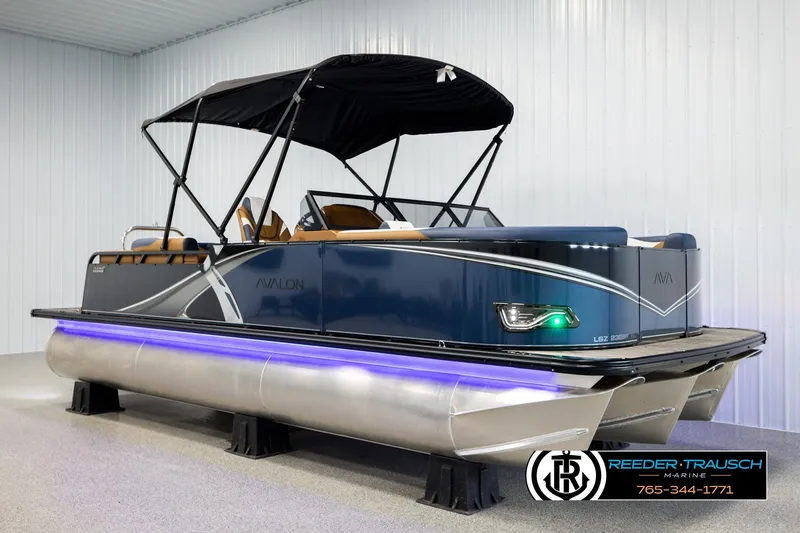 Slide: The Image of 2026 Avalon LSZ ELW pontoon boat with sleek design and modern features in showroom. - 3