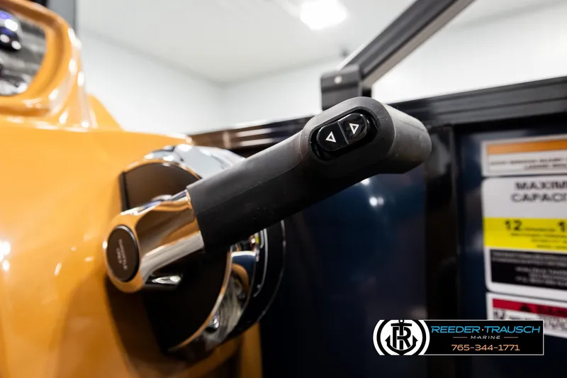 Slide: The Image of Close-up of 2026 Avalon LSZ ELW boat throttle control with adjustment buttons. - 33