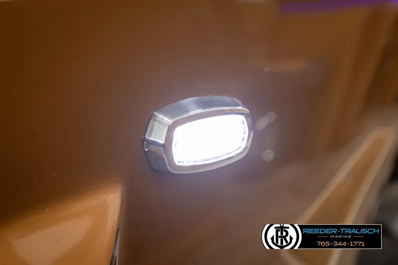 Slide: The Image of 2026 Avalon LSZ ELW boat with illuminated side light detail. - 38