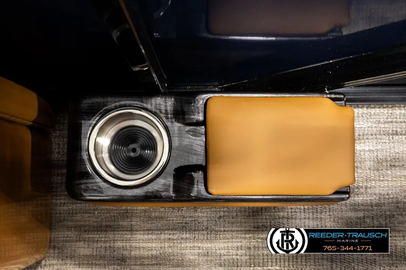 Slide: The Image of 2026 Avalon LSZ ELW boat interior with cup holder and tan armrest. - 42