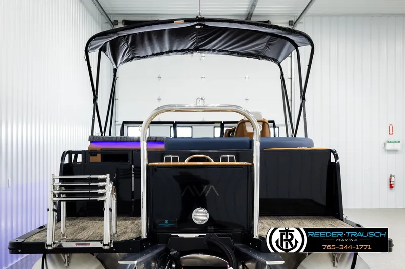 Slide: The Image of 2026 Avalon LSZ ELW pontoon boat in showroom, featuring sleek design and modern amenities. - 7