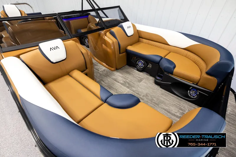 Slide: The Image of Luxurious interior of 2026 Avalon LSZ ELW pontoon boat with tan and blue seating. - 9