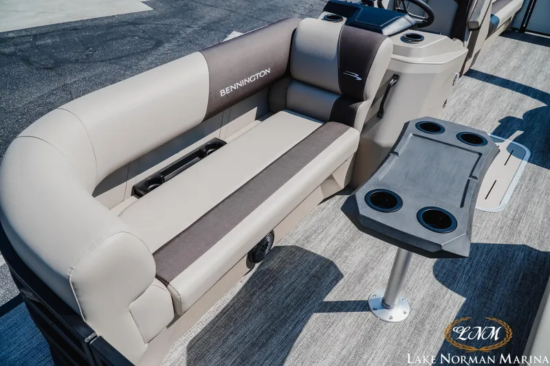 Slide: The Image of 2026 Bennington 22SSR pontoon boat interior with seating and cup holders at Lake Norman Marina. - 10
