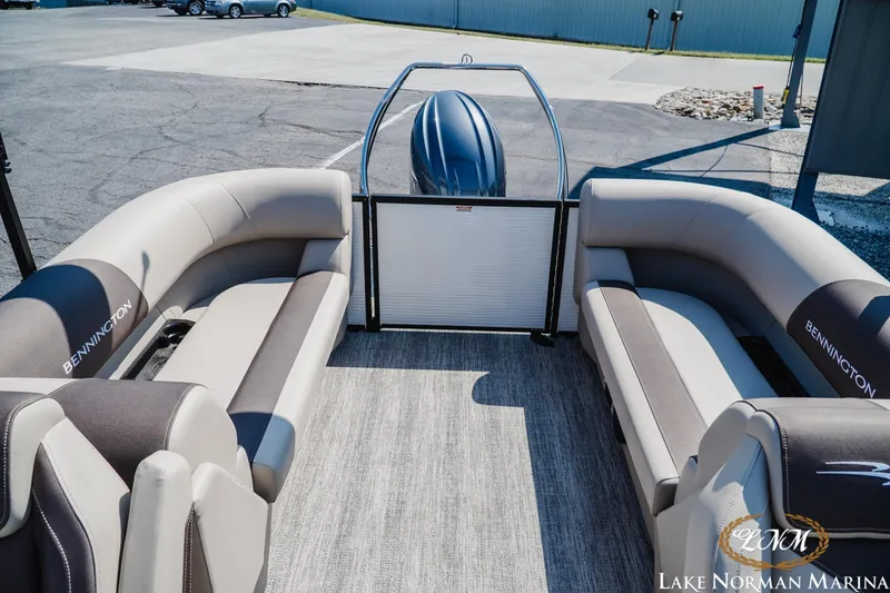Slide: The Image of 2026 Bennington 22SSR pontoon boat interior with plush seating at Lake Norman Marina. - 13