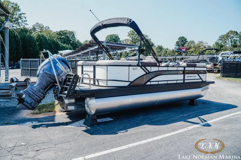 Slide: The Image of 2026 Bennington 22SSR pontoon boat at Lake Norman Marina, featuring Yamaha outboard motor. - 2