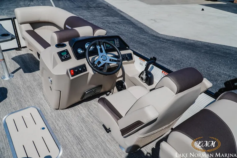 Slide: The Image of 2026 Bennington 22SSR boat interior with steering wheel and seating at Lake Norman Marina. - 5