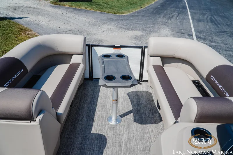 Slide: The Image of 2026 Bennington 22SSR pontoon boat interior with seating and table, Lake Norman Marina. - 7
