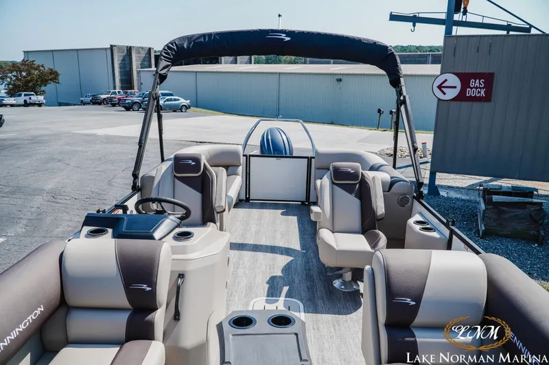 Slide: The Image of 2026 Bennington 22SSR pontoon boat at Lake Norman Marina, featuring spacious seating and modern design. - 8