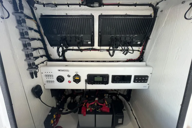 Slide: The Image of Electrical panel of 2026 Contender 26 Bay boat with wiring and control systems. - 14
