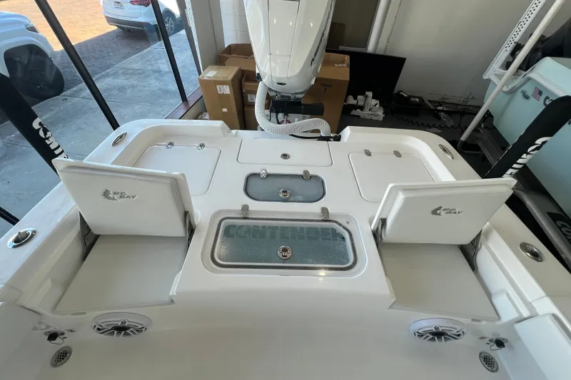 Slide: The Image of 2026 Contender 26 Bay boat interior with storage compartments and seating. - 4