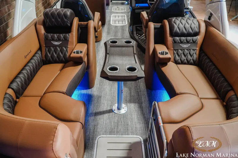 Slide: The Image of Luxurious interior of 2026 Bennington 25QFBA pontoon boat with plush seating and ambient lighting. - 10