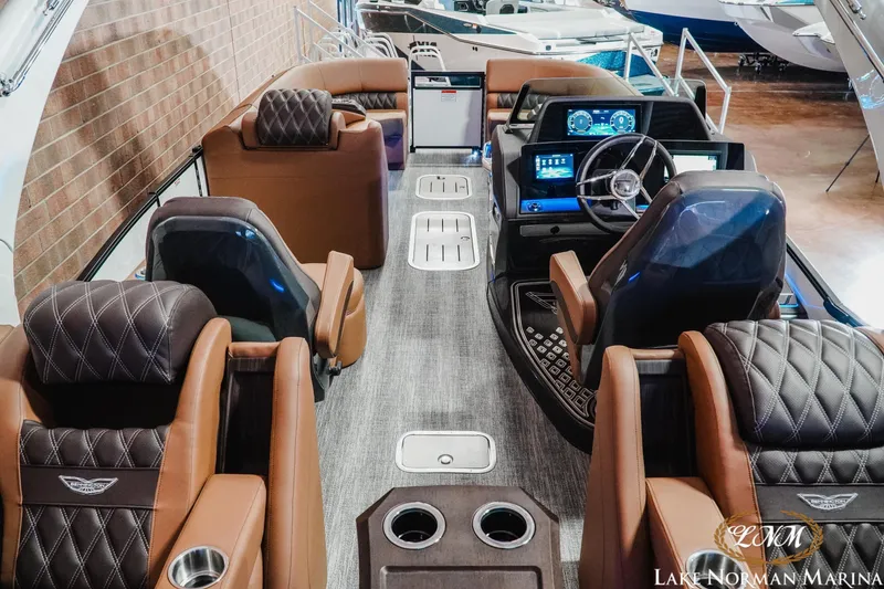 Slide: The Image of Luxurious interior of 2026 Bennington 25QFBA pontoon boat at Lake Norman Marina. - 11